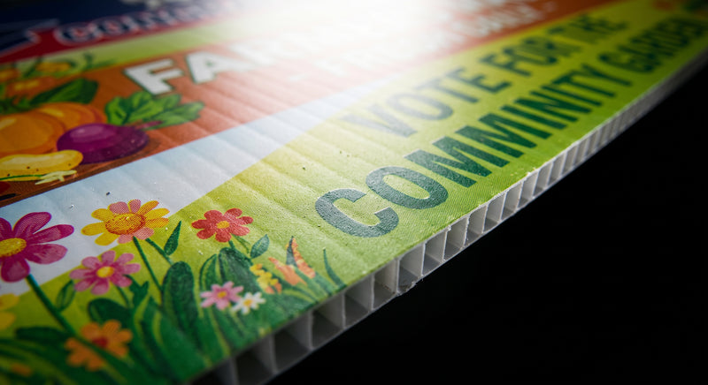 Close-up of 18x24 custom full-color yard sign on 4mm corrugated plastic (coroplast) showing vibrant print quality and durable edge